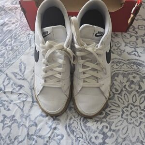 Nike White Sneakers with Black Swoosh
